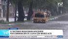 La combinación de precipitaciones y marea alta provocó severas inundaciones en varios sectores de Guayaquil, dejando vehículos afectados, árboles caídos y la suspensión de actividades escolares. Un reportaje de Ever Moreira
