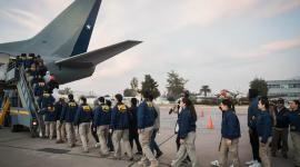 Personal de la Policía de Investigaciones de Chile trasladó a migrantes para su expulsión.